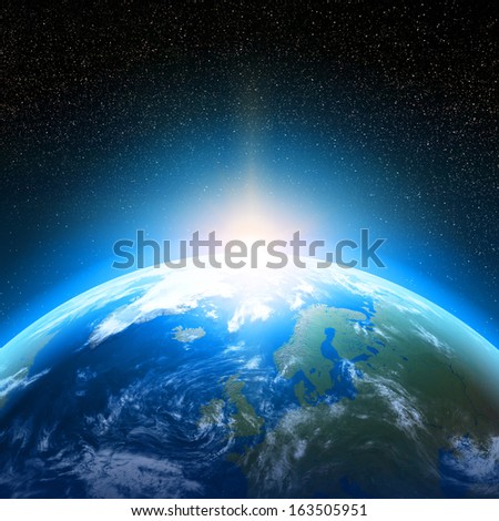 Creative abstract global communication scientific concept: space view of sunrise above Earth planet globe with world map in Solar System of Universe