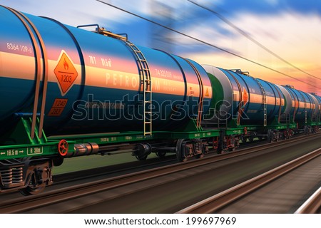 Cargo railway shipping industry and freight railroad transportation industrial concept: modern high speed train with petroleum tankcars on tracks with motion blur effect