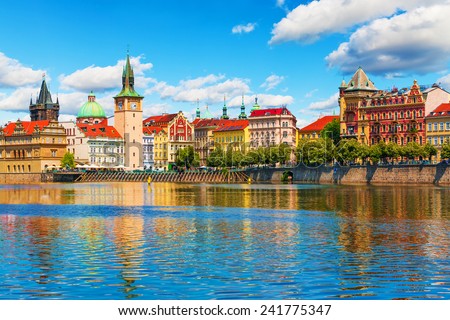 Scenic summer view of the Old Town ancient architecture and Vltava river pier in Prague, Czech Republic