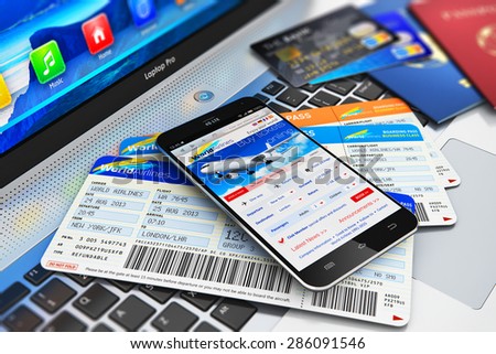 Business air travel, mobility and communication concept: smartphone or mobile phone with airline internet web site offer buying airliner tickets online, credit cards and passports on laptop keyboard