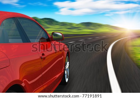 Red car driving by autobahn in sunset with motion blur