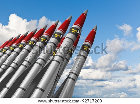 stock-photo-row-of-heavy-nuclear-missiles-against-blue-sky-with-clouds-92717200.jpg