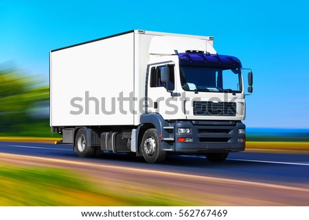 Shipping industry, logistics transportation and cargo freight transport industrial business commercial concept: white delivery truck or container auto car on road, way or highway with motion blur