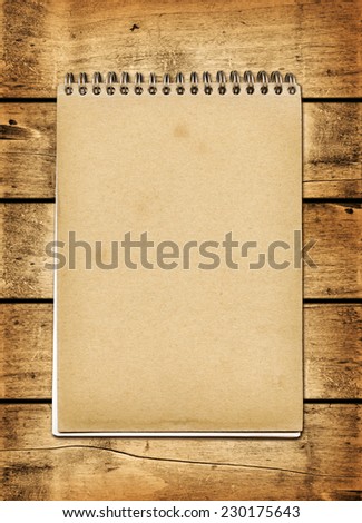 Blank vintage notebook on a wood board panel