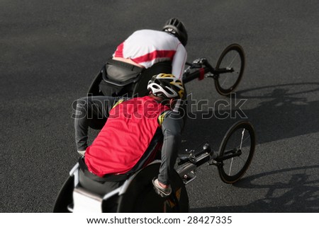 two wheelchair athletes during a marathon