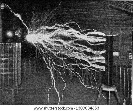 High voltage discharge in the Tesla test station, vintage engraved illustration. From the Universe and Humanity, 1910.