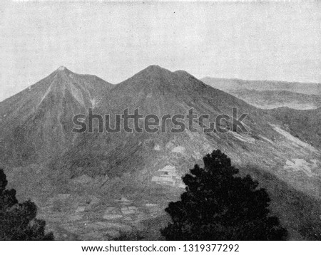 The twin volcanoes Fuego and Acatenango in Guatemala, vintage engraved illustration. From the Universe and Humanity, 1910.