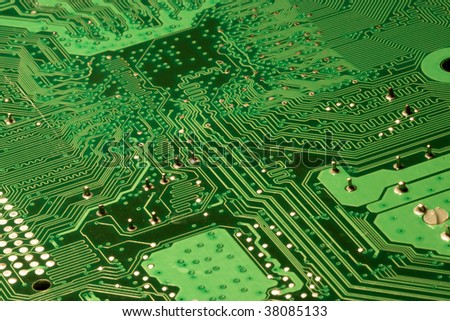 Close up of a Green computer circuit board.