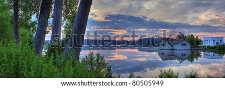 Panorama of a sunrise on a lake in High Dynamic Range.