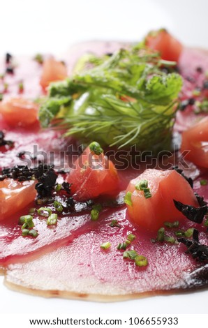 forefront of carpaccio of tuna  with diced tomatoes