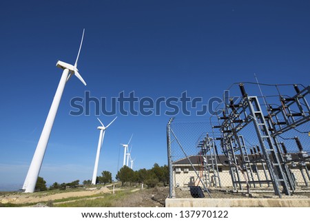 windmills for removable energy production and electrical substation