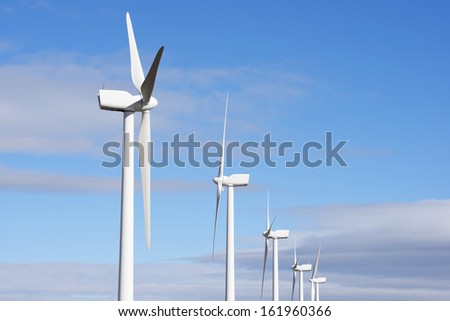 aligned windmills for renewable electric energy production, Pozuelo de Aragon, Zaragoza, Aragon, Spain