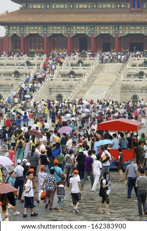 BEIJING, CHINA - AUGUST 18: Crowd on August 18, 2009 in Beijing: A multitude of tourists visit the Forbidden City.