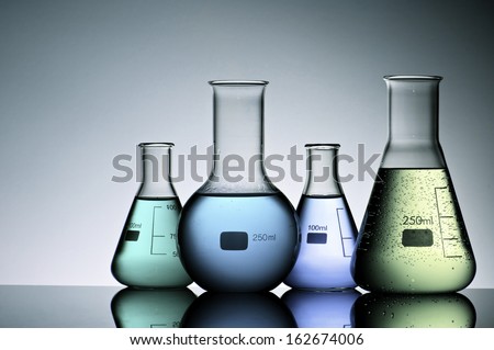 group of laboratory flasks with liquid inside