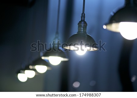 row of lamps on the inside of a bar