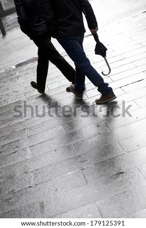 Walking along a cobblestone street, Old City Madrid, Spain