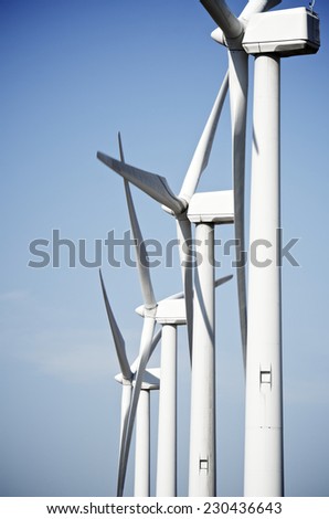 aligned group of windmills for renewable electric energy production, Cintruenigo, Navarre, Spain
