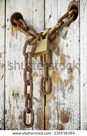 rusty lock in a wood window