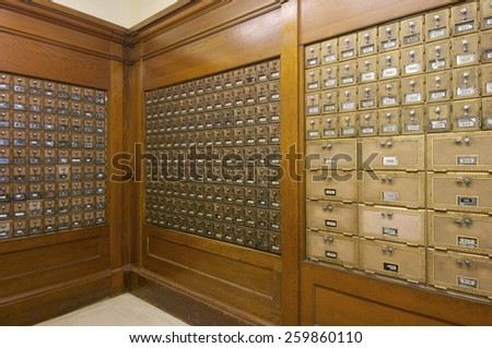 Mailboxes lined up in a post office.