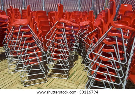 chaos of chairs stacked red