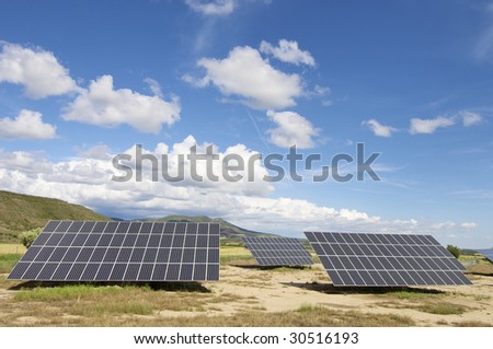 Solar field with blue sky with clouds