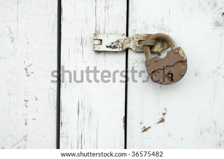 rusty lock in a wood window