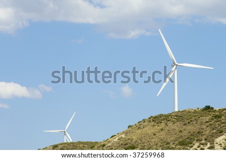 two windmills in a hill