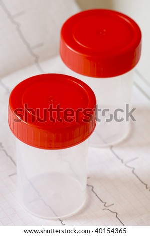 two medical containers with red cap