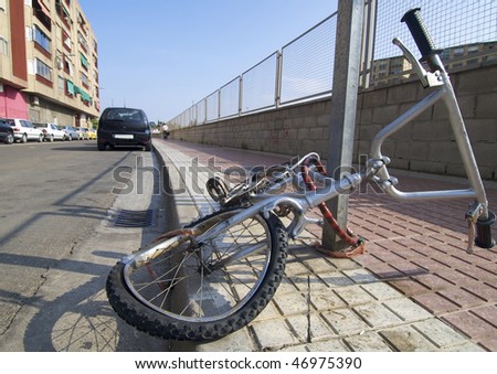broken bike abandoned in a street