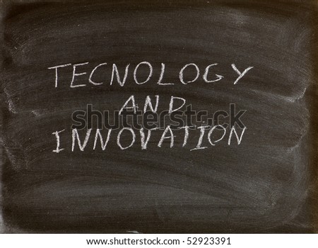 technology and innovation words written on a blackboard