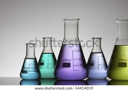 group of conical flasks containing liquid shiny