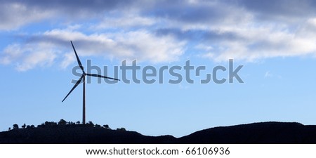 silhouette of a windmill for renewable electric energy production