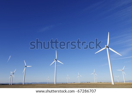 group of aligned windmills for electric power generation alternative