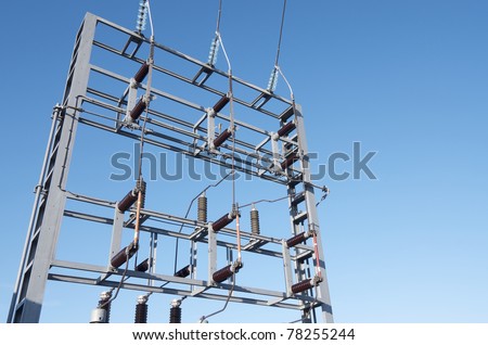 foreground of  an electrical substation with blue sky