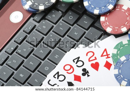 view of casino chips and cards to gamble and play online