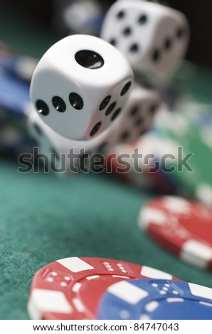 roll of the dice on a game table in a casino
