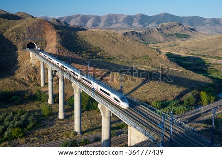 view of a high-speed train crossing a viaduct in Purroy, Zaragoza, Aragon, Spain. AVE Madrid Barcelona.