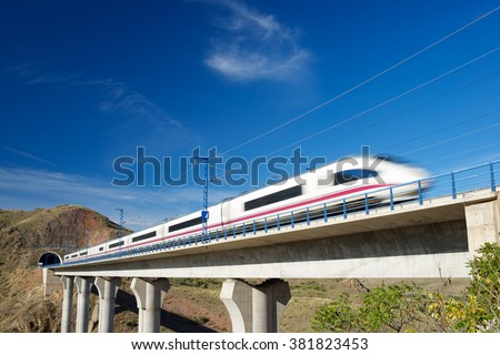 view of a high-speed train crossing a viaduct in Purroy, Zaragoza, Aragon, Spain.