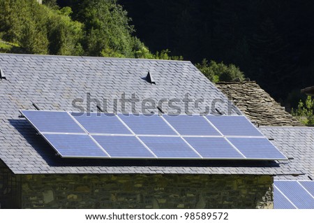 solar panels on a roof of stone slate