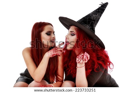 two redheads women with bloody hands halloween scene