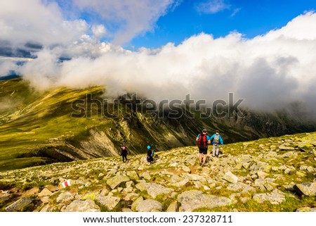 landscape with people exploring the mountains