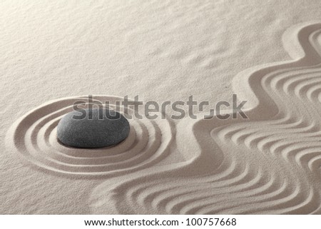 rock garden zen buddhism meditation stone and lines in sand Japanese culture concept for balance simplicity purity and concentration conceptual for spa and wellness background