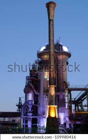 steel industry blast furnace factory or plant abandoned old industrial architecture at night with colored lights Landschaftspark Duisburg, Germany