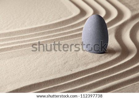 meditation and concentration for spiritual balance concept of Japanese zen garden sand and stone patterns background