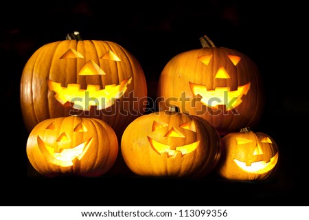 Halloween lantern head pumpkins scary spooky and creepy faces in the dark night