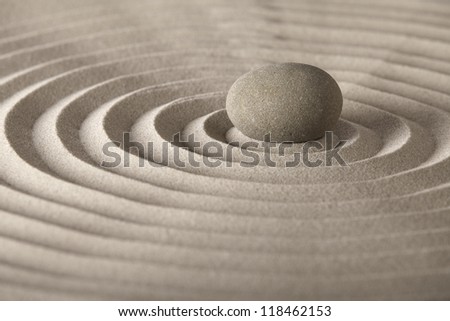 stone for spa relaxation or zen meditation concept for purity spirituality harmony and simplicity pattern in the sand