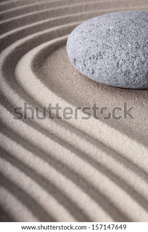 Japanese meditation spa garden pattern of sand and stones with curved lines for balance and relaxation zen buddhism