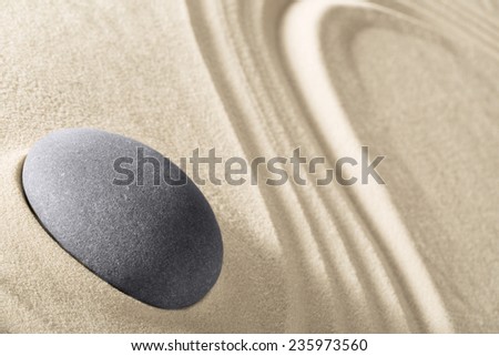 concentration and spirituality in Japanese zen garden spa background with stone and lines in sand concept for meditation and relaxation