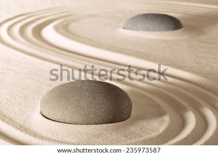 harmony and purity in zen garden. Stones and lines in sand create serenity and balance. Spirituality spa and wellness background