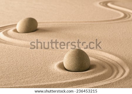 zen stones and lines in sand of Japanese garden. Purity harmony and balance.